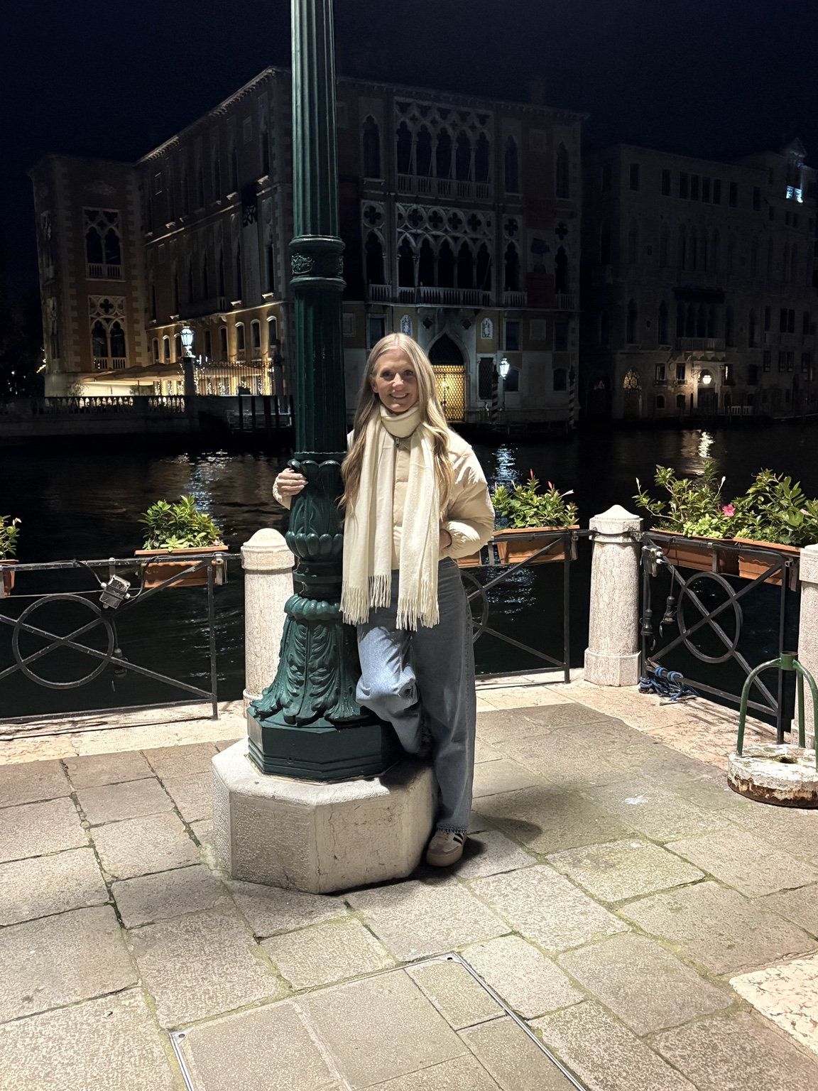 Amy by the canal in Venice at night